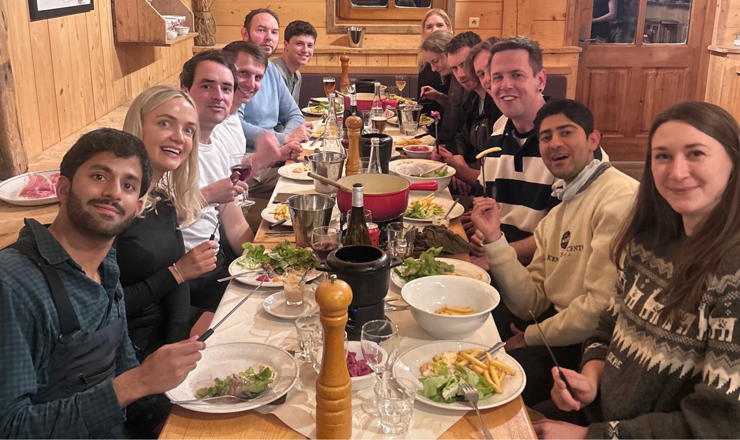 Corporate incentive group enjoying local cuisine in traditional log cabin style restaurant